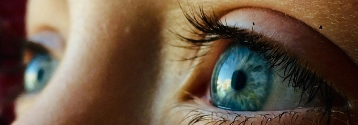 A close up of a persons eyes. They are blue.