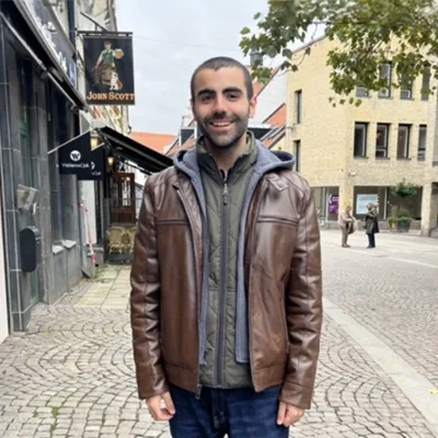 Jonathan Reilly smiling outside.