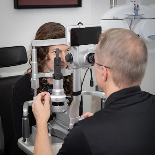 Matthew Foley giving an eye exam.